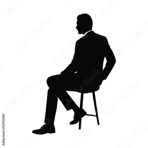 silhouette of business man sitting backwards on chair casual pose