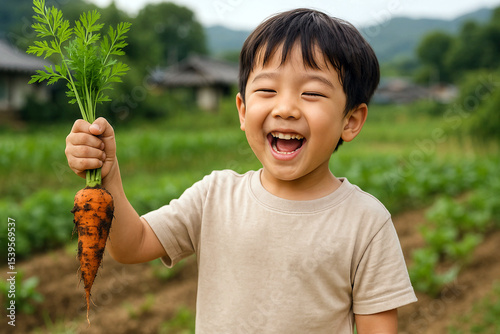 Happy Child Harvesting a Fresh Carrot in the Garden