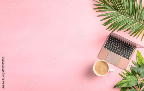 coffee and laptop on pink table