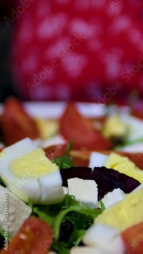 Healthy breakfast with eggs and vegetables. Soft-fried egg steaming, salad lettuce wraps with chia seeds, cherry tomato, skillet pot, cast iron. Healthy eating. High quality 4k footage