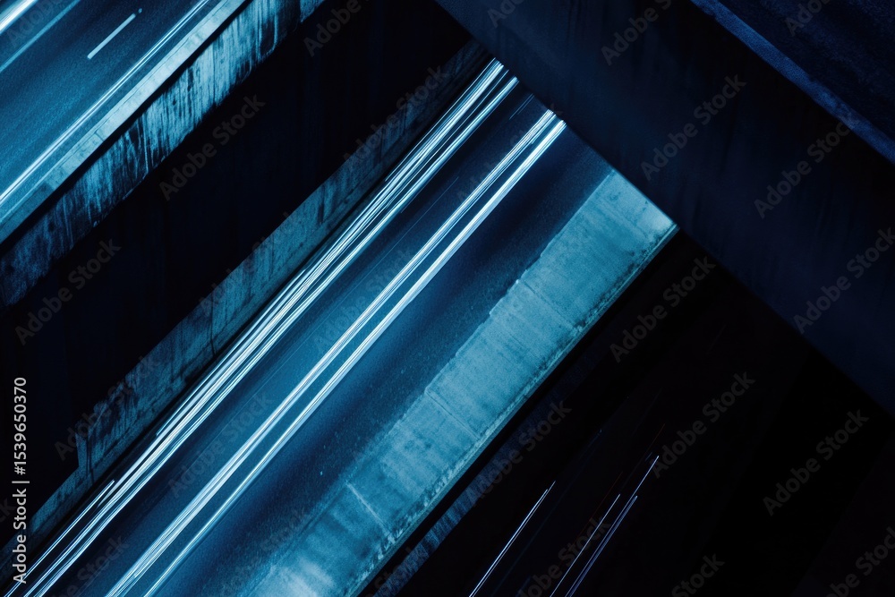 Obraz premium Night traffic flows through elevated highway overpasses