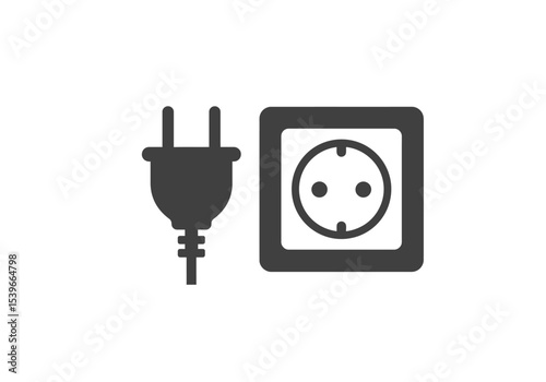 An electrical plug is disconnected from a power outlet on a white background