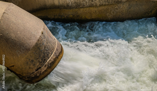 powerful water flowing out spillway dam