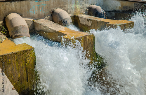 powerful water flowing out spillway dam
