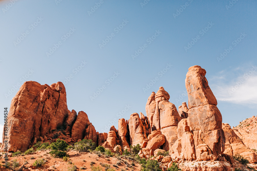 Fototapeta premium Red rock pinnacles under a blue sky in Arches National Park, Utah