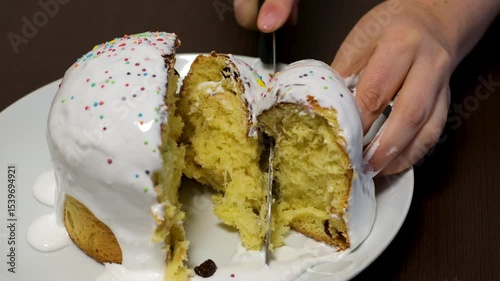 Panettone. Traditional Italian Easter bread with dried berries and chocolate. Easter basket in the hands of a woman in a cozy house. in Italy the Lombardy region. Symbol of Christmas.