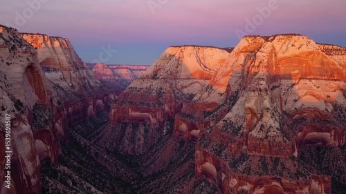 Stunning Aerial View of Mountainous Landscape at Sunset in Dramatic Canyon Setting with Colorful Sky