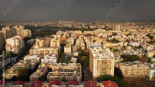 Aerial shot of BTM lake and city skyscrappers in background in Bangalore, Karnataka, India	