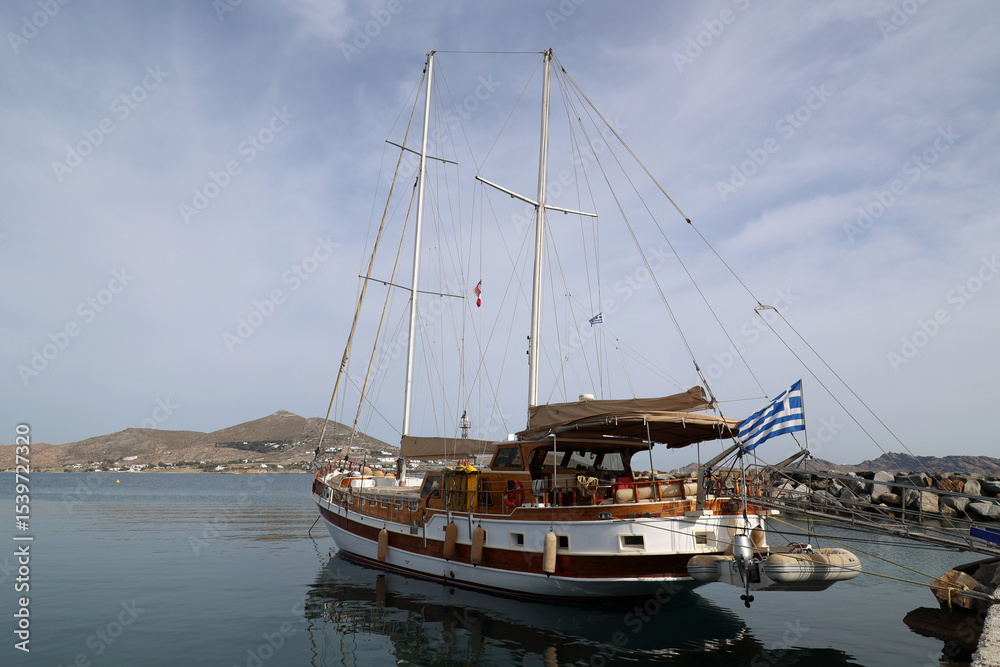 Obraz premium Sailing ship in the port of Naoussa on the Cyclades island of Paros- Greece 
