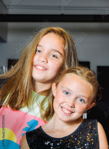 The portrait of two teenage girls. Having a good time at a party