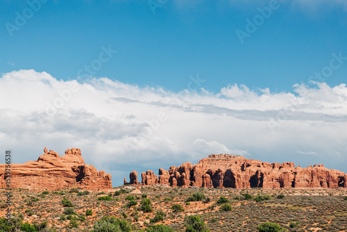 Red rock pinnacles under blue sky in Arches National Park, Utah photo