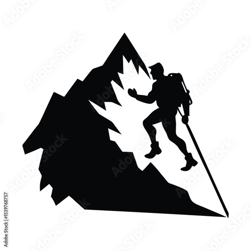Silhouette of a person climbing snowy ridge