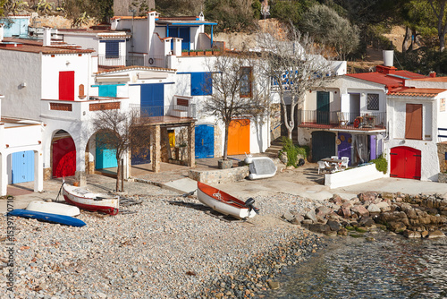 Picturesque colorful mediterranean shoreline in Girona. Salguer cove. Fisherman houses photo