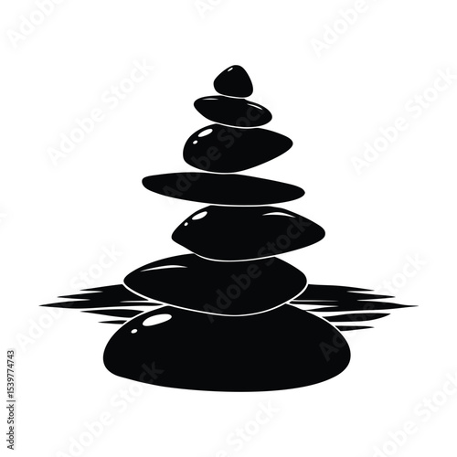 Silhouette of rock cairns stacked for balance zen-style
