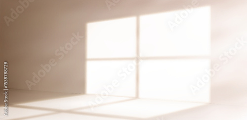 Soft window shadow on wall - natural sunlight casting geometric pattern through glass panes. Minimal interior bg with warm morning glow for home decor, product display or peaceful space concept.