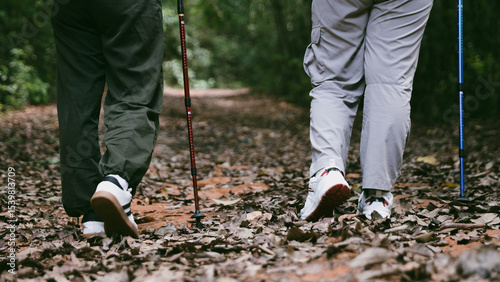 Hiking action on mountain grass trail path. Close up of female hiker shoe. adventurous lifestyle of hiker and backpack to travel and trek mountain, enjoy every walk and hike part of thrilling journey