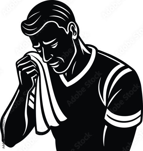 a tired footballer wiping