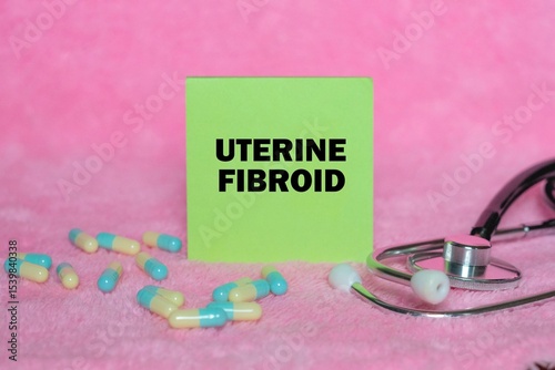 Uterine Fibroid writing concept on sticky note isolated on pink background. stethoscope as decoration.
