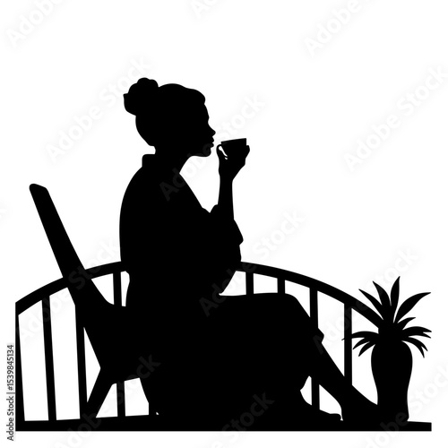 Silhouette of person sipping tea on terrace in robe, relaxation and wellness concept