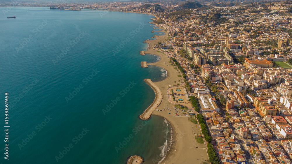 Fototapeta premium Drone Image of Calm Waters and Historic Seaside Homes in Pedregalejo Beach