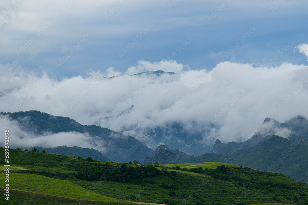 Naklejka premium mountains and clouds