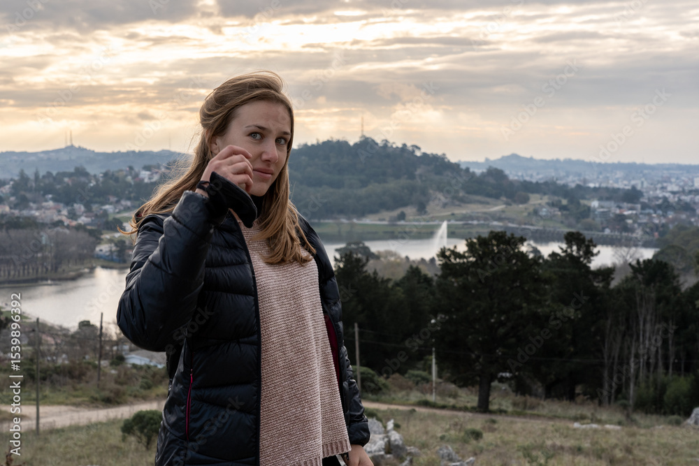 Naklejka premium Woman traveling in Tandil, Argentina at sunset