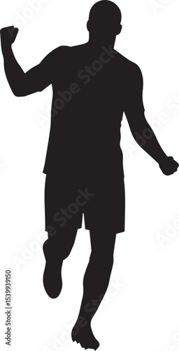 Silhouette of a soccer player running and celebrating