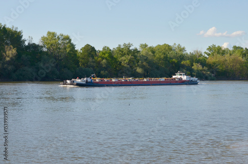 Coal barge on the river carries coal