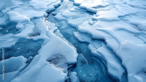 Close-up of textured ice formations with blue hues.