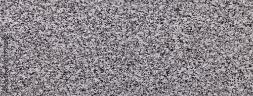Granite stone background with fine grain texture in gray and black tones for kitchen countertop or tabletop use