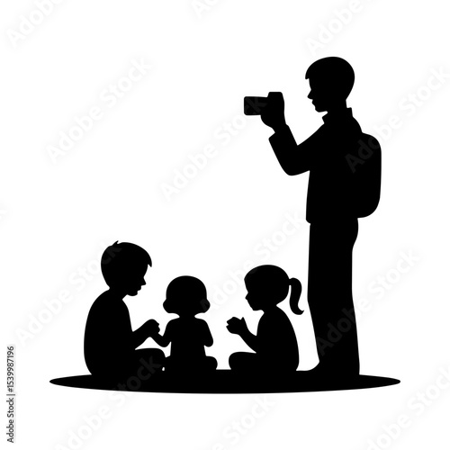 Man photographing children sitting together during Photographer's Day  