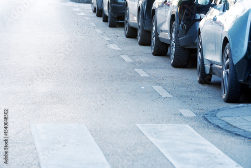 Detail of parking lot of cars on road