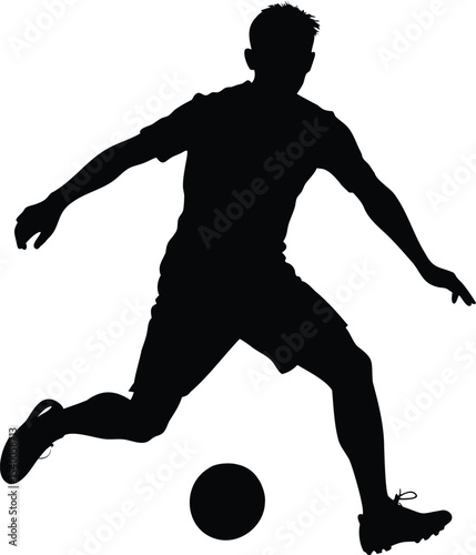 Silhouette of a soccer player kicking a ball in mid air action