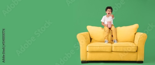 Surprised boy with popcorn ...