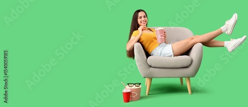 Young woman with popcorn wa...
