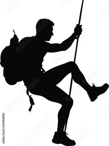 A Silhouette of a Man Mountain Climbing Holding on to a Rope