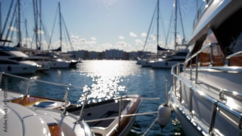 Yachts in the marina. Sunlight rays through the harbor of yachts. Luxury luxury leisure boats in the marina. Boats in the harbor lifestyle.