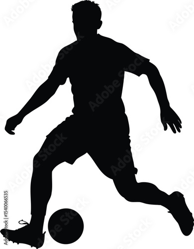 Silhouette of a soccer player in action dribbling a soccer ball