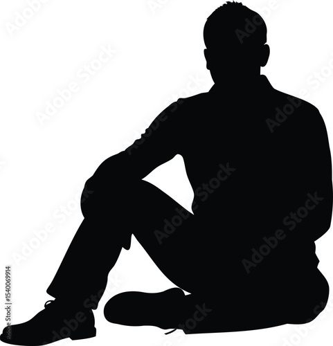 Silhouette of a Man Sitting on the Ground in a Relaxed Pose