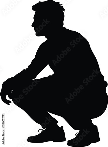 Silhouette of a man squatting and looking toward the left side