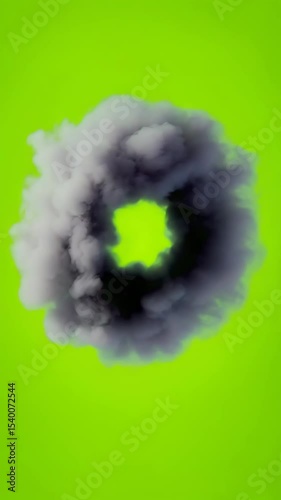 Circular smoke ring on a bright green background. The smoke is dark gray and appears to be isolated, creating a striking visual effect.