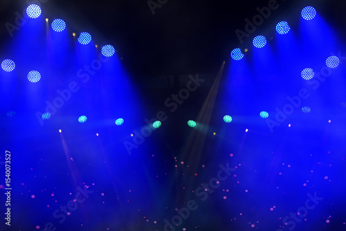 A light show with many lights in the air. The lights are blue and purple. The lights are in the air and are not on the ground