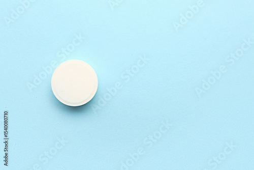 White medical pill on blue ...