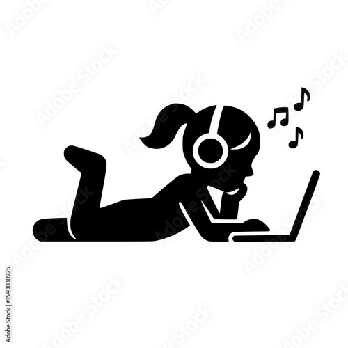 Thoughtful girl lying on her stomach with headphones and laptop, listening to music, on a white background
