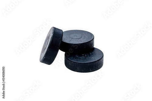 High-Resolution Image of Three Stacked Black Hockey Pucks, Perfect for Sports Websites, Blogs, and Graphic Design Projects, Ideal for Clean Background, Professional Use, and Versatile Applications.