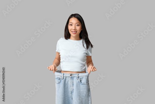 Beautiful young happy Asian...