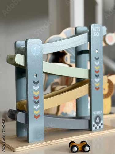 Wooden Race Track Toy with car in kid's playroom