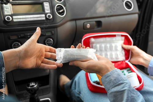 Woman passing bandages from...