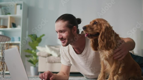 Micro joys, Mental Wellness, Everyday Balance. Young Man Works on Laptop While Interacting With His Dog on Sofa. A Soft, Supportive Moment Blending Focus, Emotion, and Connection