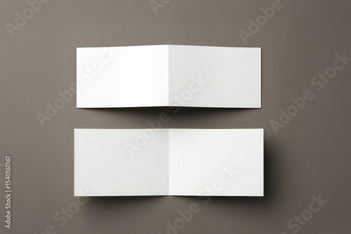 Two open landscape bifold brochure mockups on a neutral background, showcasing blank inner pages for design presentation.